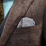 Herringbone patterned FatCloth Gregory Bone puff fold in a brown herringbone tweed pocket