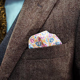 Carnival patterned FatCloth Heston White puff fold in a brown herringbone tweed pocket