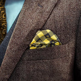 Lumberjack patterned FatCloth Stig Yellow puff fold in a brown herringbone tweed pocket